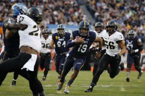 Navy quarterback Keenan Reynolds rushes during