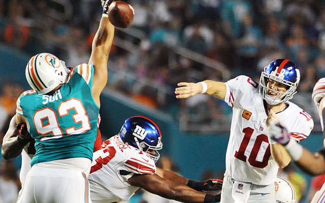 Ndamukong Suh tries to block an Eli Manning pass on Monday night