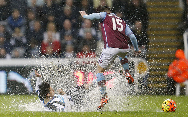 Newcastle's Florian Thauvin fights for the ball with Villa's Ashley Westwood