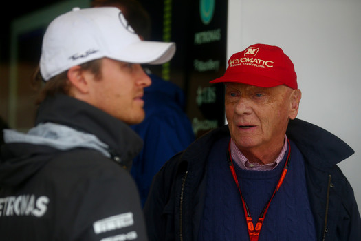 Nico Rosberg of Germany and Mercedes GP speaks with Mercedes GP non-executive chairman Niki Lauda