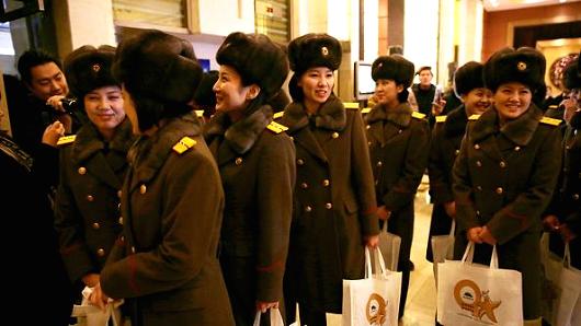 Members of the North Korean female music group Moranbong Band arrive at a hotel after concert rehearsal