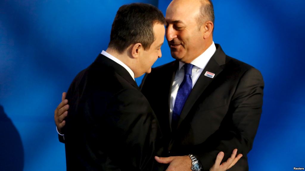 OSCE Chairman Serbian Foreign Minister Ivica Dacic greets Turkish Foreign Minister Mevlut Cavusoglu as he arrives for the OSCE Ministerial Council meeting in Belgrade Serbia Dec. 3 2015