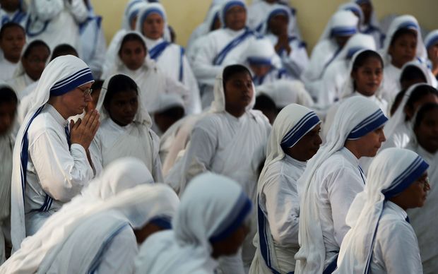 Nuns from the Missionaries of Charity attend mass to commemorate the 105th birthday of Mother Teresa in Kolkata