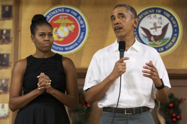 First lady Michelle Obama looks on as President