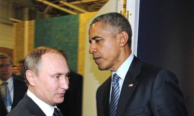 Vladimir Putin left and U.S. President Barack Obama shake hands at the COP21 UN Conference on Climate Change in Paris France Monday Nov. 30 2015