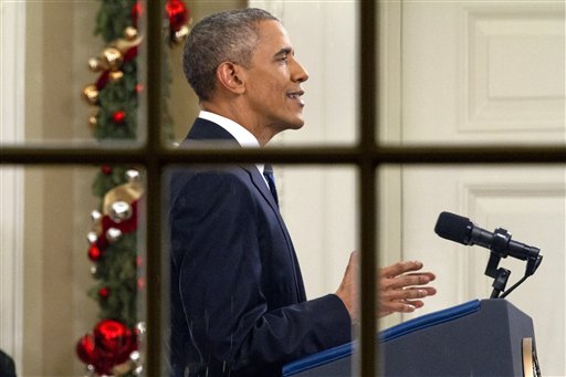 President Barack Obama addresses the nation from the Oval Office at the White House in Washington Sunday night Dec. 6 2016. The president's speech followed Wednesday's shooting in San Bernardino California that killed 14 people and wounded