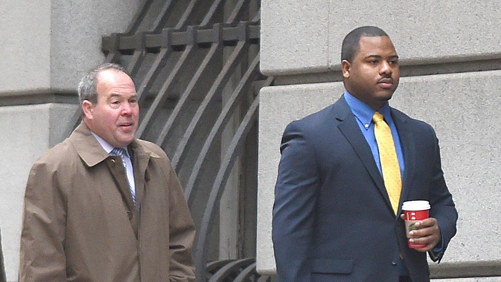 Officer William Porter arrives in Baltimore court for the first day of trials in the Freddie Gray case