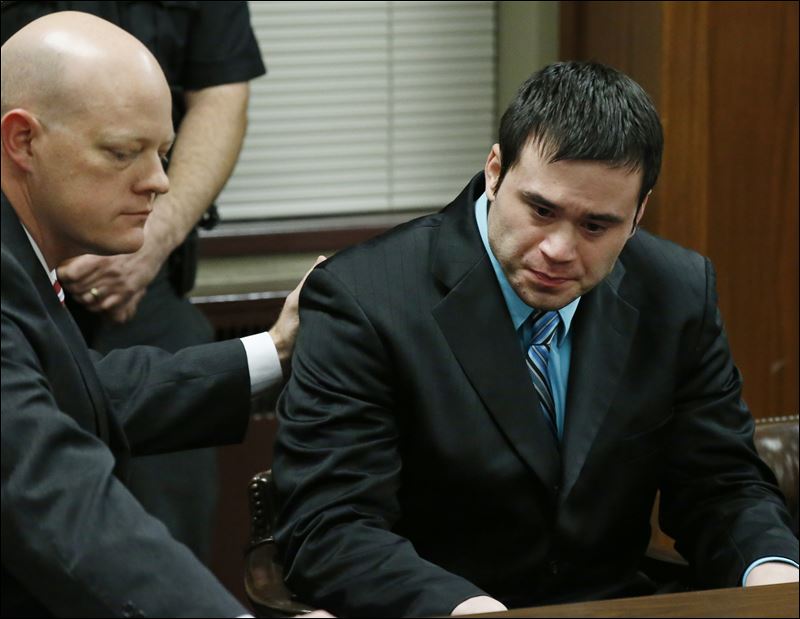 Defense attorney Robert Gray left puts his hand on the shoulder of defendant Daniel Holtzclaw right as they wait for the verdicts in his trial in Oklahoma City Thursday Dec. 10 2015