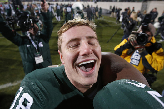 EAST LANSING MI- NOVEMBER 28 Connor Cook #18 of the Michigan State Spartans celebrates after the game against the Penn State Nittany Lions at Spartan Stadium