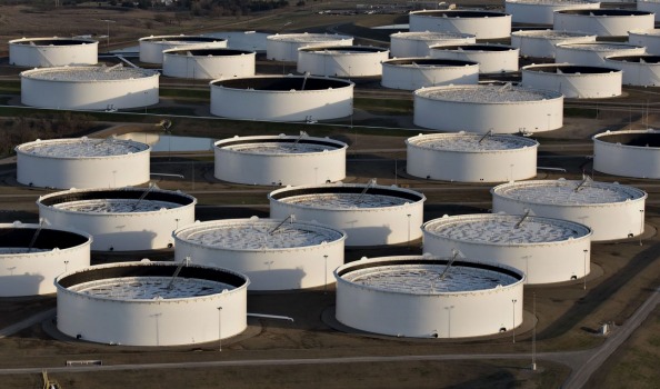 Crude supplies rose to 490.7 million barrels leaving stockpiles more than 120 million barrels above the five-year seasonal average government data showed