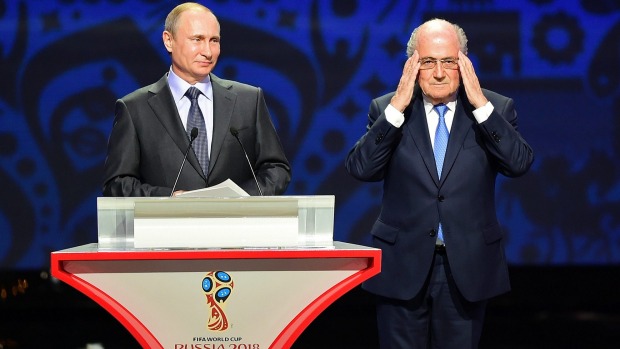 Old pals Vladimir Putin lavished praise on embattled FIFA boss Sepp Blatter