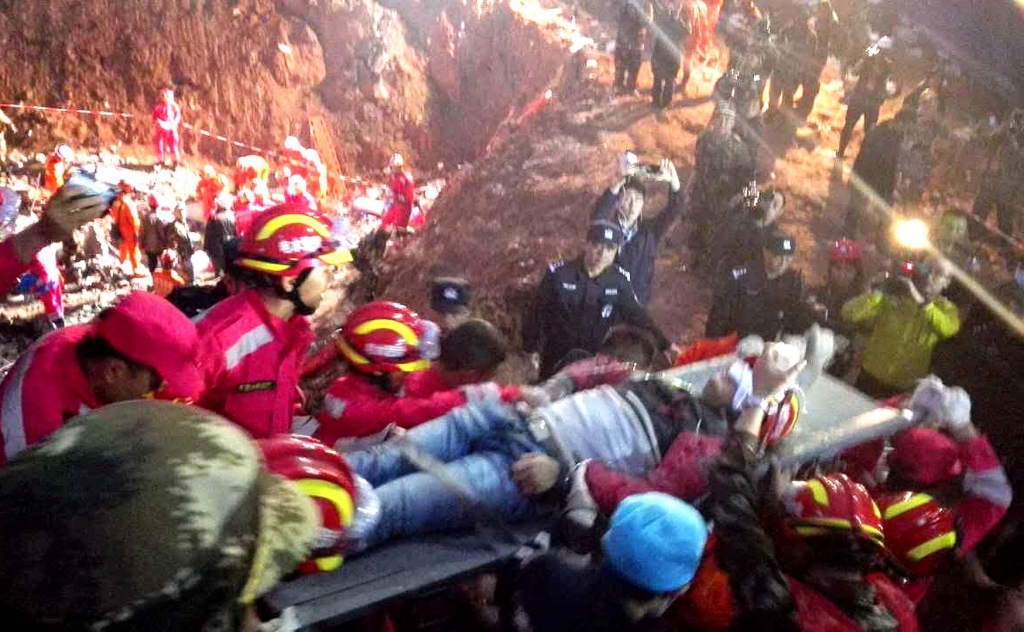 One survivor found as China pledges landslide probe