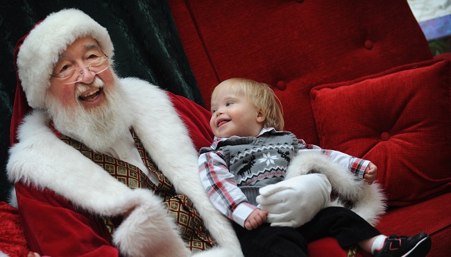 Claus at Briarwood Mall in Ann Arbor Mich. Sunday Dec. 6 2015. Amid the dim lights and quiet of the closed shopping center 30 families with autistic children visit Santa and