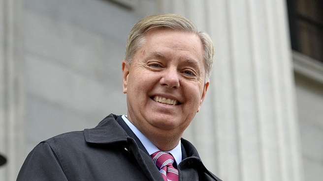 Sen. Lindsey Graham R S.C. walks down the steps of the State Capitol building in Columbia S.C