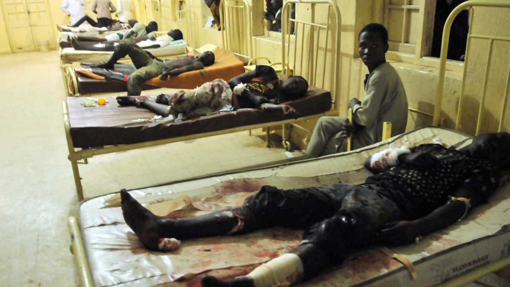 Injured men and boys receive treatment at a local hospital following an explosion at a mobile phone market in Kano Nigeria. Wednesday Nov. 18 2015