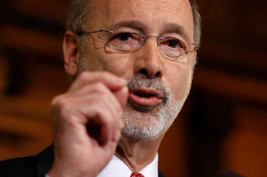 Pennsylvania Gov. Tom Wolf speaks with members of the media Tuesday Dec. 29 2015 at the state Capitol in Harrisburg Pa. Wolf says he is rejecting parts of a $30.3 billion state budget plan that's already a record six months overdue but he's freeing