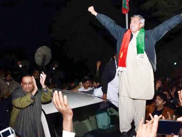 PTI leader Jahangir Khan Tareen celebrates his victory during a rally in Lodhran