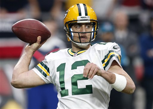 Green Bay Packers quarterback Aaron Rodgers throws against the Arizona Cardinals during the first half of an NFL football game Sunday Dec. 27 2015 in Glendale Ariz