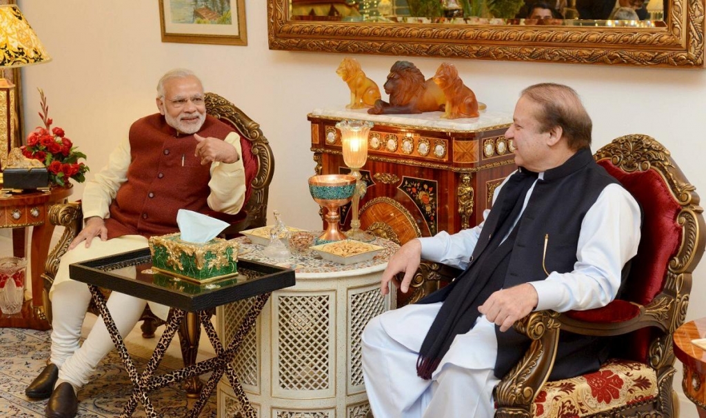 Pakistani prime minister Nawaz Sharif talks with his Indian counterpart Narendra Modi in Lahore Pakistan. – Reuters pic