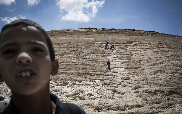 Palestinian children make their way home from school in the E1 area