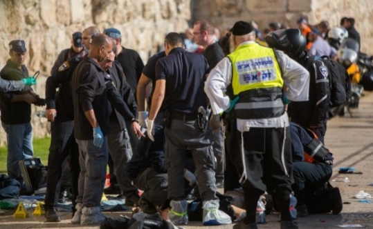 Israeli security personnel at the scene where two Palestinian stabbed tree Israelis at the Old City's Jaffa Gate in Jerusalem