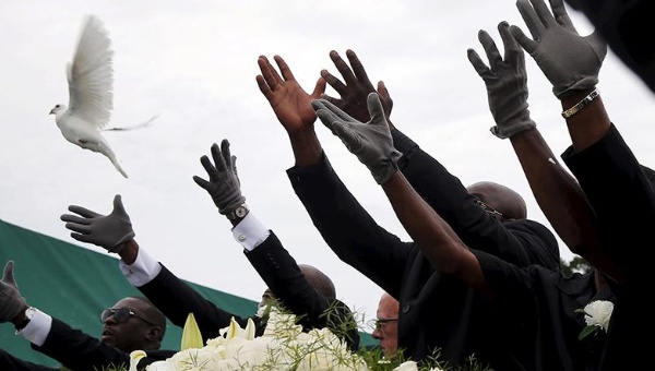 Pall bearers release white doves over the casket of mass shooting victim Ethel Lance in North Charleston South Carolina