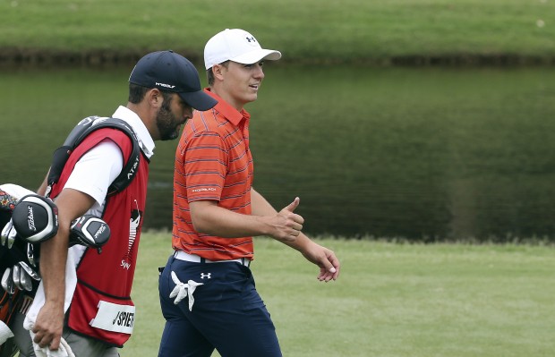 Jordan Spieth of the U.S. gives fans a thumbs up after he hit an eagle on the 17th during the Australian Open Golf Tournament in Sydney Australia Saturday Nov. 28 2015