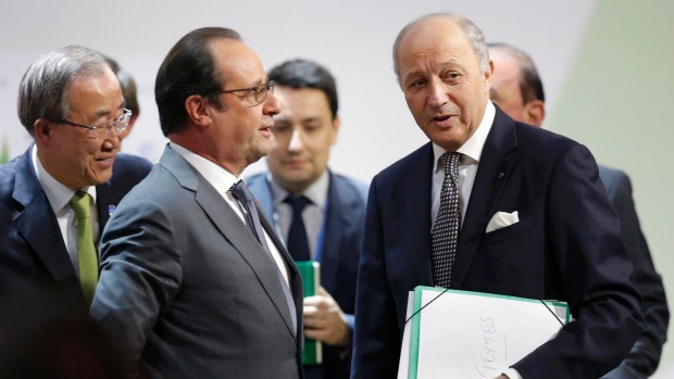 French President Francois Hollande talks with Foreign Affairs Minister Laurent Fabius President-designate of COP21 at the World Climate Change Conference in Paris France