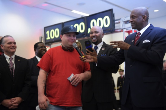 Passenger Larry Kendrick middle speaks next to Hartsfield Jackson Atlanta International Airport Manager Miguel Southwell righ