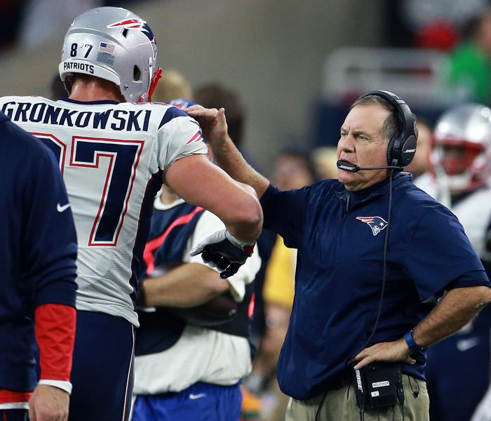 12/13/15 Houston TX Patriots TE Rob Gronkowski geta a pat on the shoulder from head coach Bill Belichick following a first quarter reception. The New England Patriots visited the Houston Texans in a regular season NFL football game at NRG Stadium. (Glo