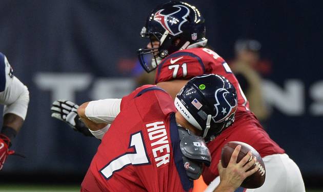 Houston Texans quarterback Brian Hoyer is sacked by New England Patriots defensive end Akiem Hicks during the second half of an NFL football game Sunday Dec. 13 2015 in Houston. Hoyer was injured on the play and left the game. (AP