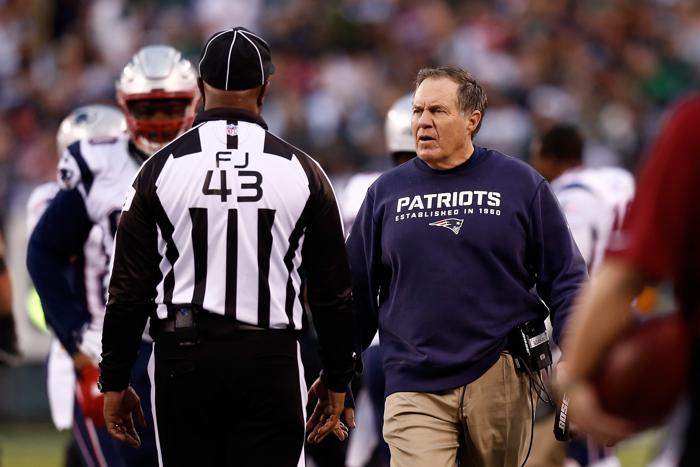 EAST RUTHERFORD NJ- DECEMBER 27 Head coach Bill Belichick of the New England Patriots talks with a referee during their game against the New York Jets at Met Life Stadium