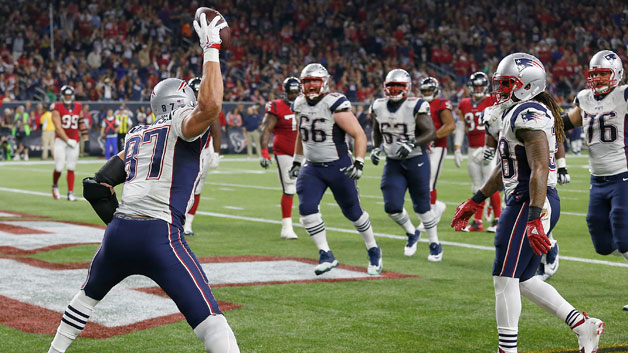 Patriots tight end Rob Gronkowski spikes the ball after scoring a touchdown against the Houston Texans