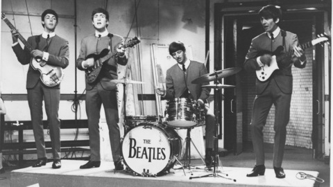 Paul McCartney guitarist John Lennon drummer Ringo Starr and guitarist George Harrison perform on live TV in 1963