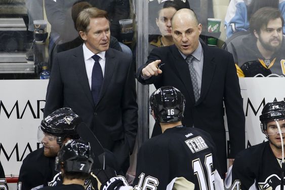 Johnston left listens to assistant coach Rick Tocchet as he gives instructions during an NHL hockey game against the Los Angeles Kings in Pittsburgh Friday Dec. 11 2015. The Kings won 3-2 in a shootout. (AP