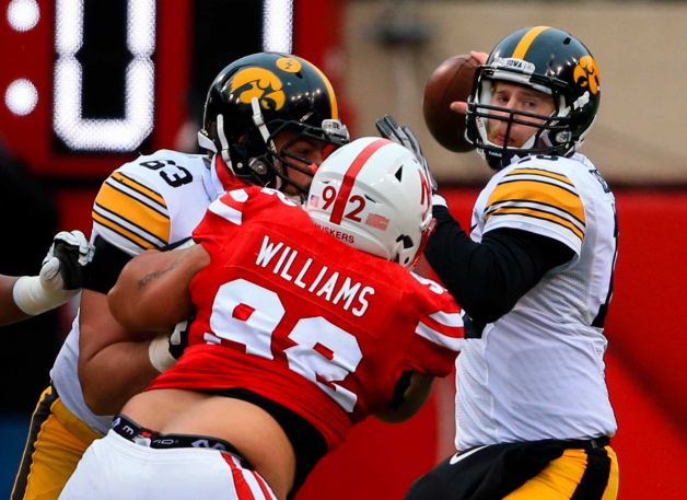 Iowa quarterback C.J. Beathard looks to throw as offensive lineman Austin Blythe blocks Nebraska defensive tackle Kevin Williams during the first half of an NCAA college football game in Lincoln Neb. Friday Nov. 27 2015