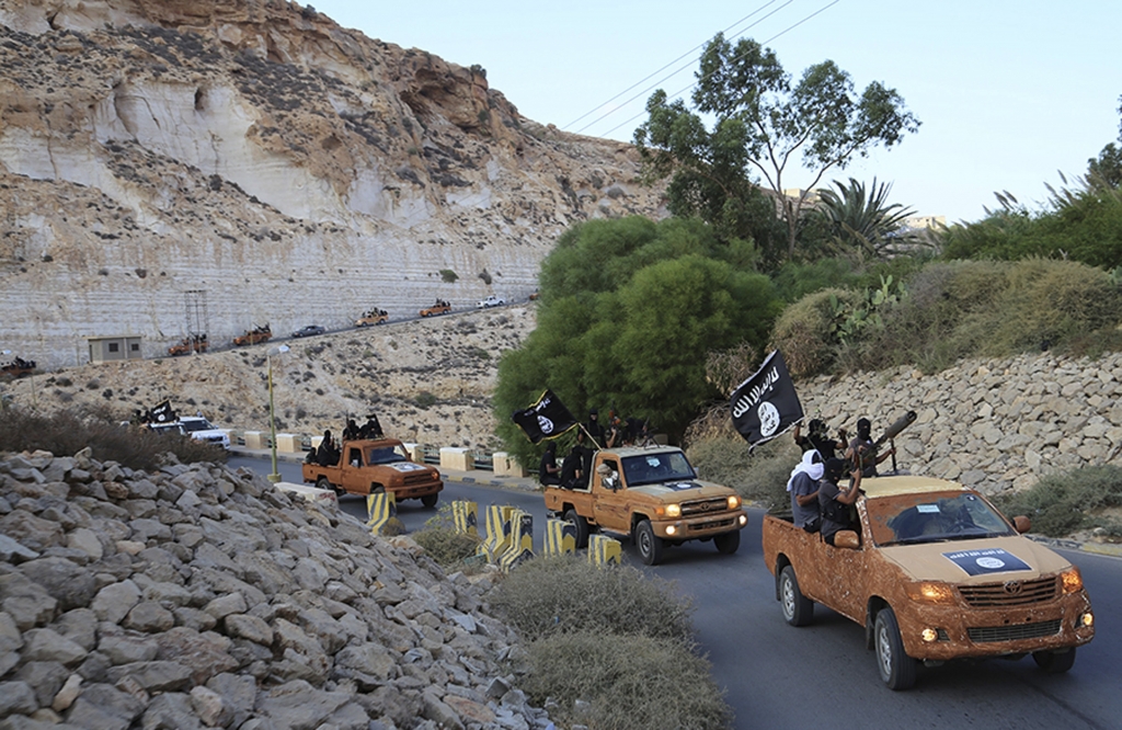 An armed motorcade belonging to members of Derna's Islamic Youth Council consisting of former members of militias from the town of Derna drive along a road in Derna eastern Libya