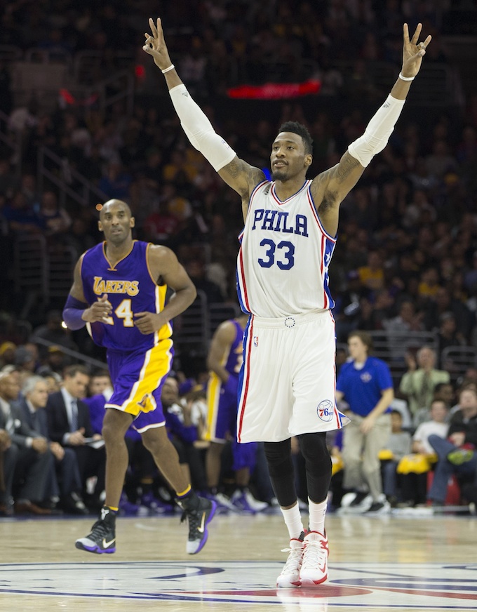 Robert Covington of the 76ers reacts in front of Kobe Bryant