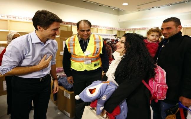 Syrian refugees headed to Canada on first planeload