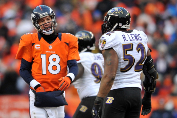 DENVER CO- JANUARY 12 Peyton Manning #18 of the Denver Broncos stnads on the field next to Ray Lewis #52 of the Baltimore Ravens during the AFC Divisional Playoff Game at Sports Authority Field at Mile High