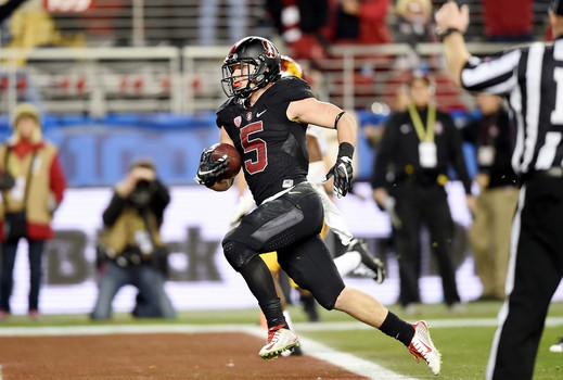 Christian Mc Caffrey #5 of the Stanford Cardinal scores the first of two touchdowns against the USC Trojans