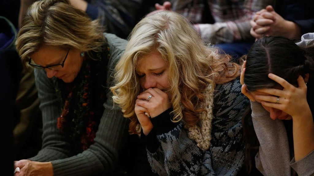 People attend a vigil held on University of Colorado Colorado Springs campus for those killed in a deadly shooting at a Planned Parenthood clinic Nov. 28 2015