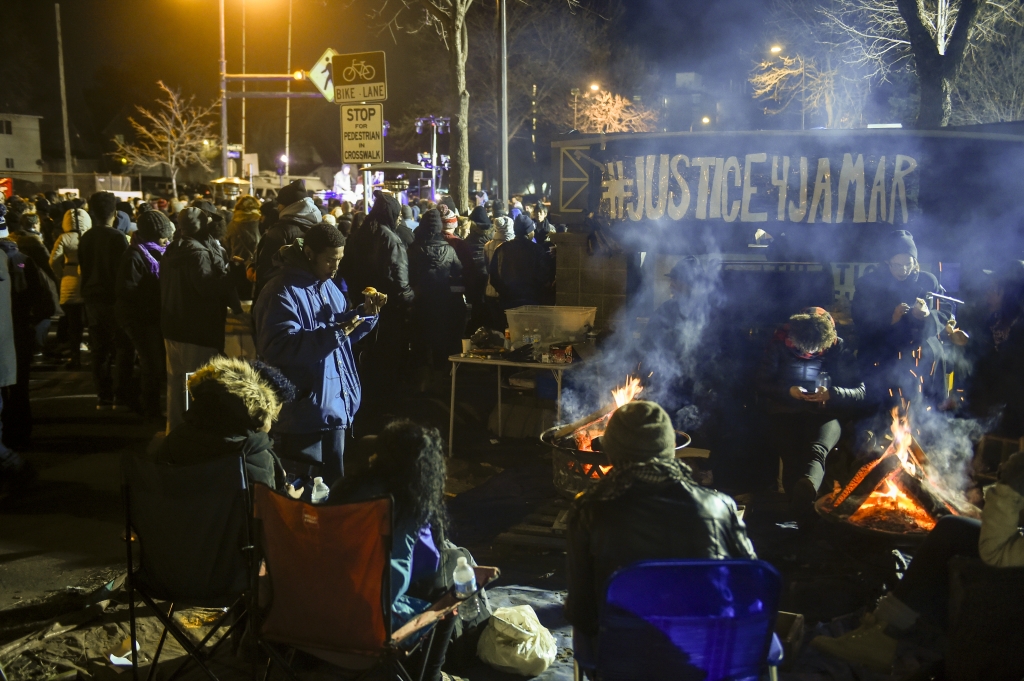 Demonstrators camp outside the Minneapolis Police Departments 4th Precinct during a protest for the death of Jamar Clark Tuesday Nov. 24 2015 in Minneapolis. The fatal shooting of Clark a black man by a Minneapolis police officer has pushed raci