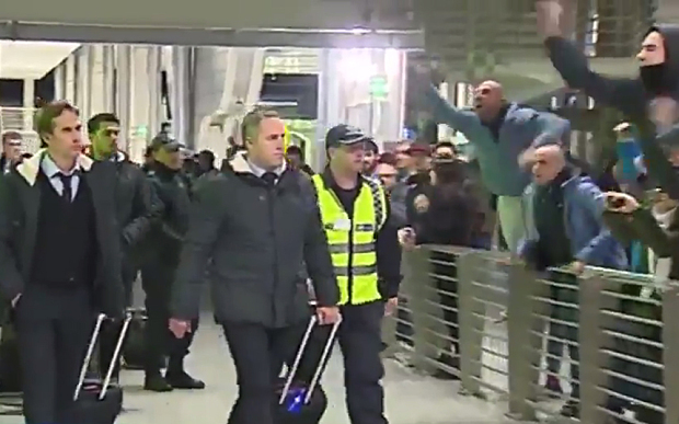 Porto fans make their feelings known as the team make their was through Arrivals at the airport