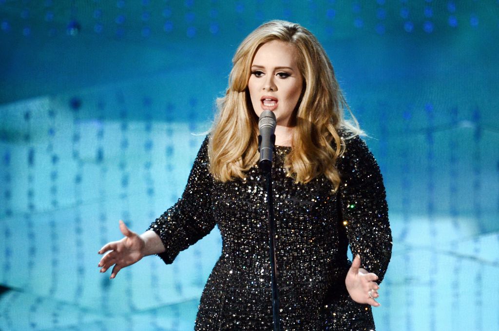 HOLLYWOOD CA- FEBRUARY 24 Singer Adele performs onstage during the Oscars held at the Dolby Theatre