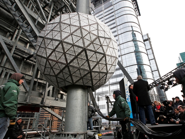 Workers prepare to test the Waterford crystal ball for the New Year's Eve celebration atop One Times Square in New York Tuesday Dec. 30 2014. The ball which is 12 feet in diameter and weighs 11,875 pounds is decorated with 2,688 Waterford crysta