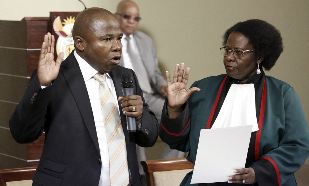 Justice Sisi Khampepe swears in South Africa's new finance minister David van Rooyen as South Africa's president Jacob Zuma looks on during a ceremony at the Union building in Pretoria