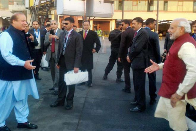 Prime Minister Narendra Modi is greeted by his Pakistani counterpart Nawaz Sharif on his arrival in Lahore on Friday