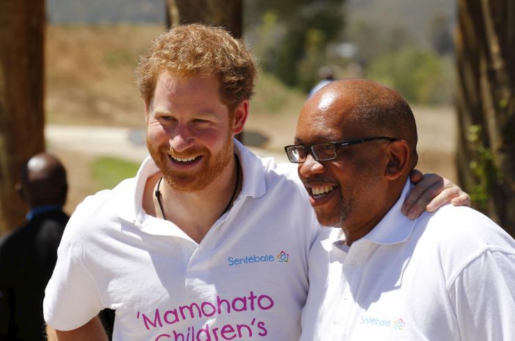 Britain's Prince Harry and Lesotho's Prince Seeiso react during a visit on behalf of Sentebale