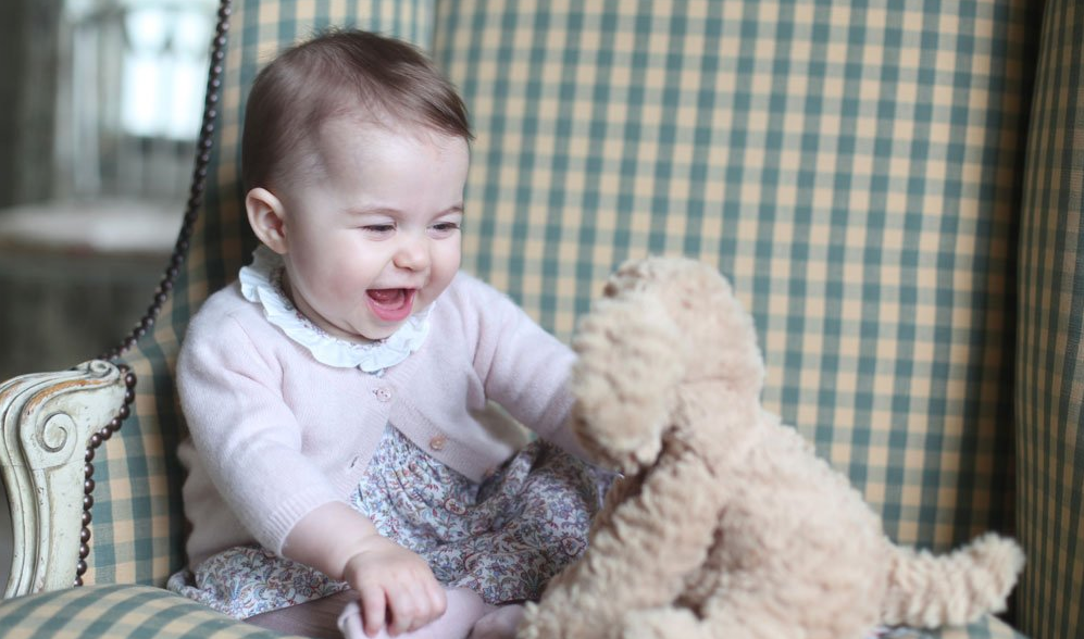 Princess Charlotte shares a laugh with her stuffed animal